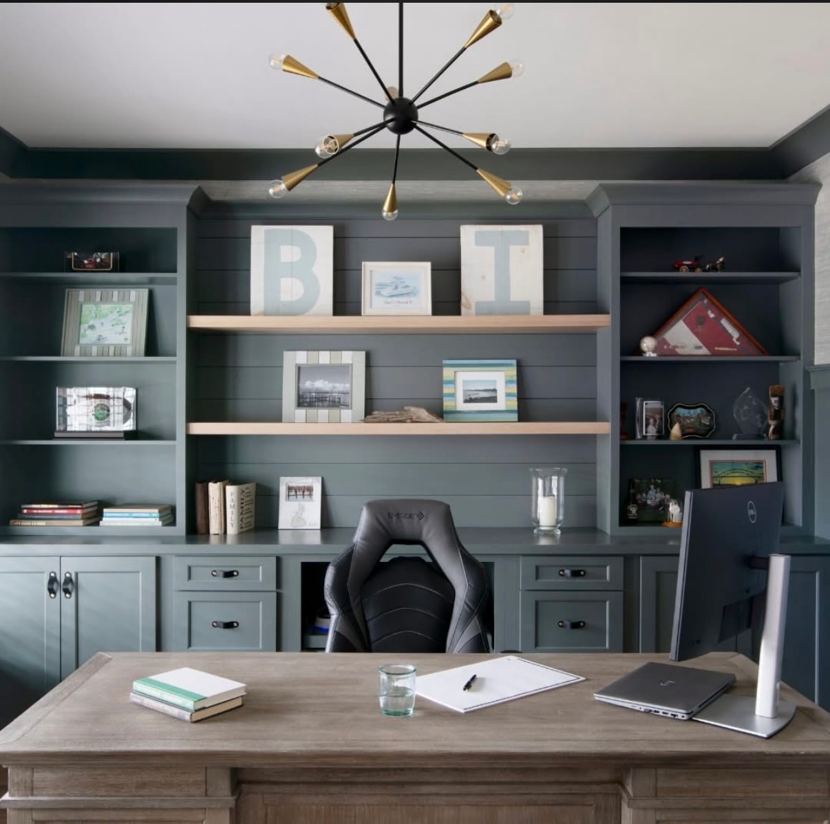 Black and brass Sputnik chandelier over home office desk with custom teal built-in shelving in Pinehills Plymouth MA by Luster and Volt